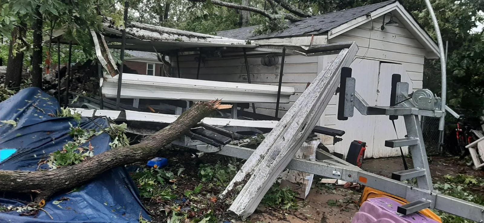 Outbuilding crushed by a fallen tree