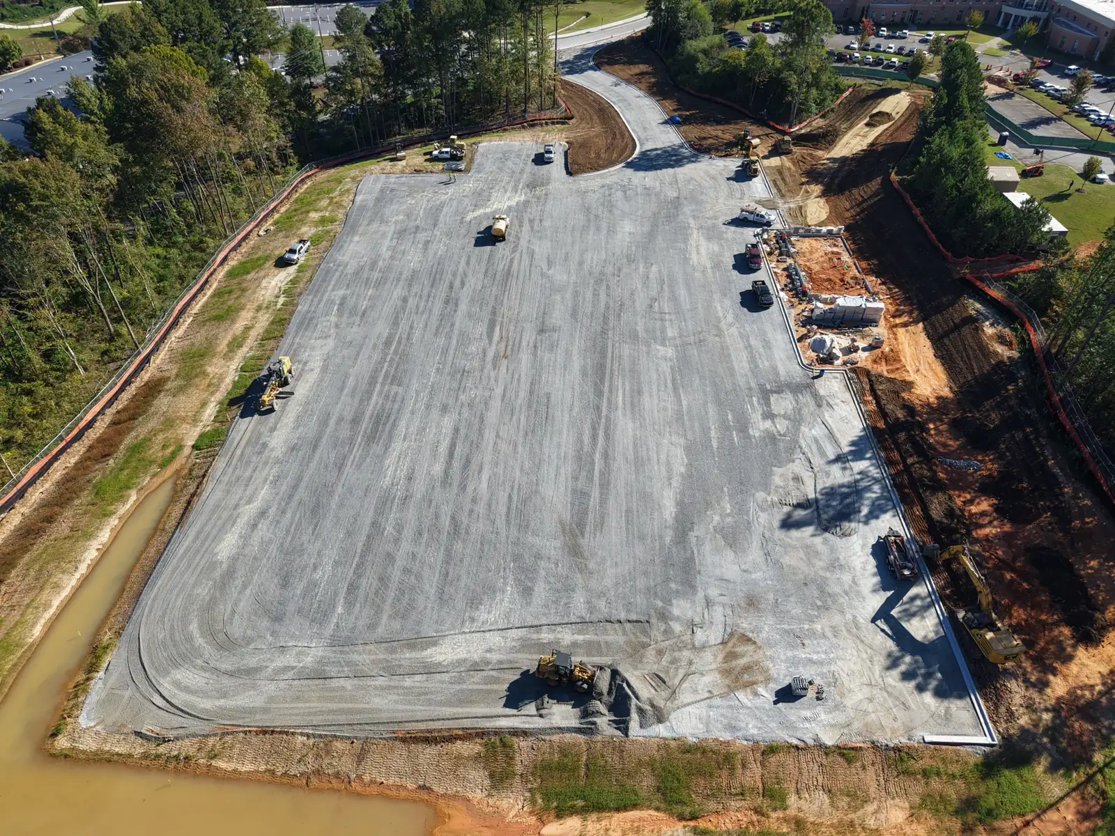 Drone view down the length of the CDL training pad with stone base spread and equipment working in Dallas, Georgia