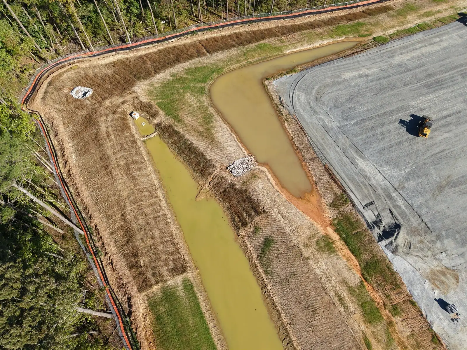 Drone view of the stormwater detention area and outlet structure along the west edge of the TCSG-411 CDL pad