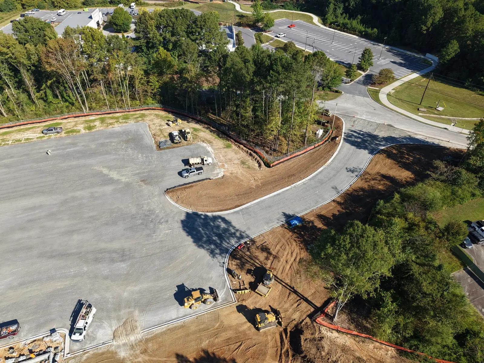 Drone view of the curbed entrance drive leading into the TCSG-411 CDL pad in Dallas, Georgia